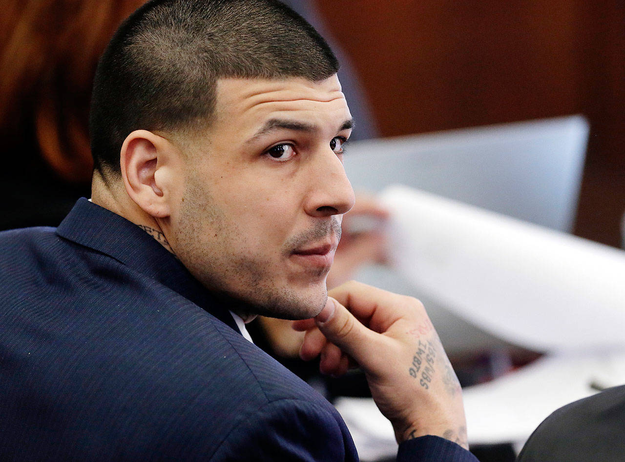 In this March 15, 2017 file photo, defendant Aaron Hernandez listens during his double murder trial in Suffolk Superior Court in Boston. Hernandez was declared not guilty in the case. (AP Photo/Elise Amendola, Pool, File)