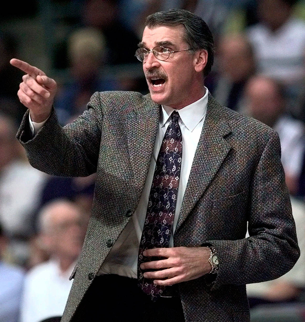 In this March 8, 2000, file photo, Detroit Pistons coach George Irvine directs players from the bench during an NBA game against the Denver Nuggets in Auburn Hills, Michigan. The Indiana Pacers announced Tuesday that Irvine has died. The former University of Washington basketball standout was 69 and had been battling cancer. (AP Photo/Duane Burleson, File)