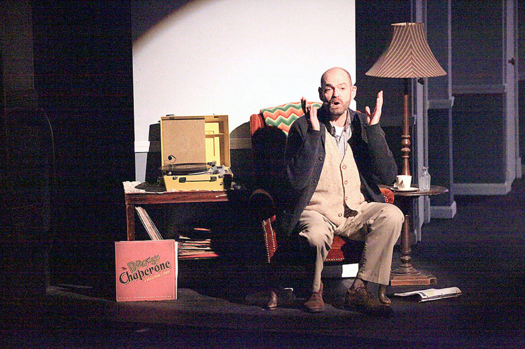 Dale Sutton photo Man in Chair (Patrick J. Lucey-Conklin) talks to the audience about his favorite musical, “The Drowsy Chaperone.”
