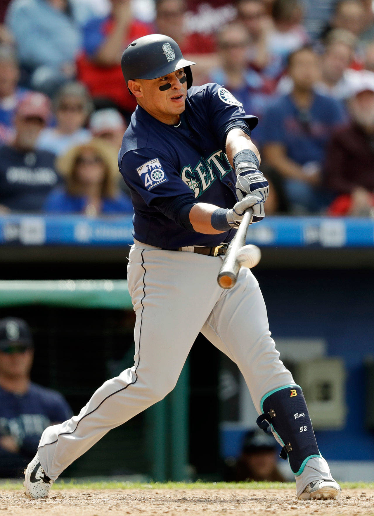 Seattle catcher Carlos Ruiz hits a three-run double off Philadelphia Phillies relief pitcher Joaquin Benoit during the seventh inning of Wednesday’s game in Philadelphia. Seattle won 11-6. (AP Photo/Matt Slocum)
