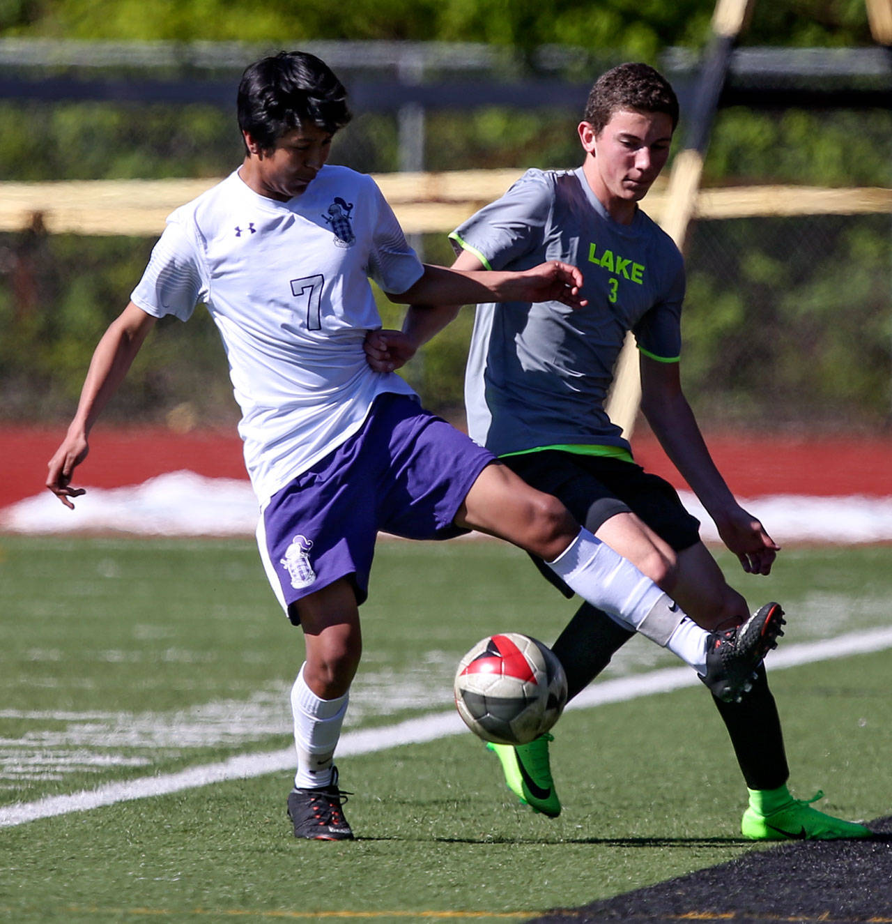 Kamiak’s Manuel Segura (left) and Lake Stevens’ Kameron Jackson vie for control of the ball during Saturday’s 4A District 1 match in Mukilteo. Segura’s goal won the match for the Knights 1-0. (Kevin Clark / The Herald)