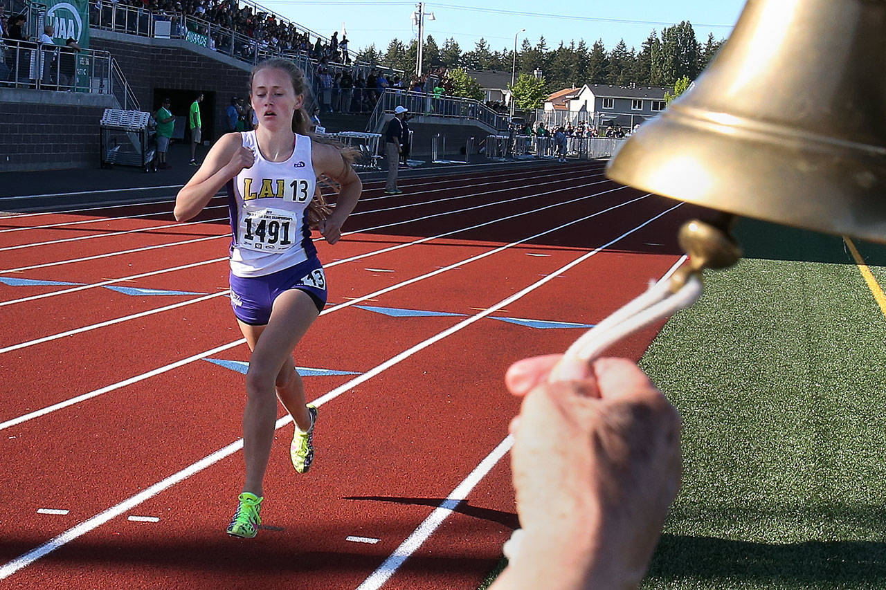 Lake Stevens sophomore Taylor Roe makes her way through the lap bell to take first place in the 1,600 meters during the state track and field championships on May 25, 2017, at Mount Tahoma High School. (Kevin Clark / The Herald)