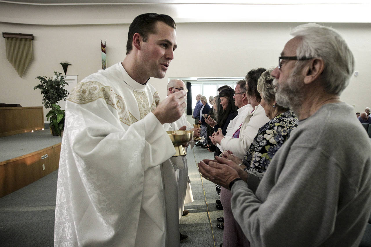 Pastor Kevin Craik conducts an Easter Sunday service at his new All Saints Church in Everett on April 15. (Ian Terry / The Herald)