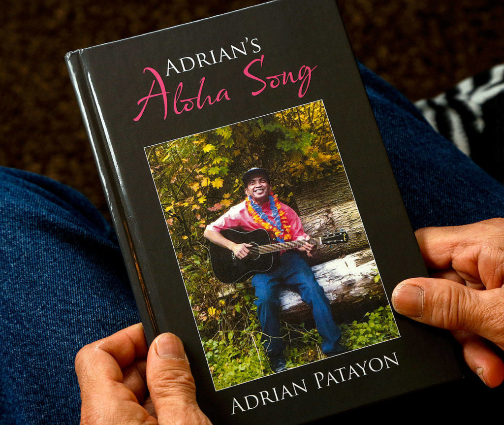 Patayon’s book “Adrian’s Aloha Song” recounts his ups and downs through childhood and into adulthood living with cerebral palsy. (Dan Bates / The Herald)
