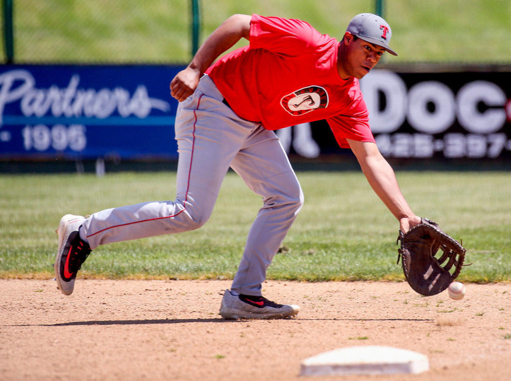 Peyton Cordova-Smith digs for a ground during practice Friday afternoon at Everett Memorial Stadium in Everett on May 19, 2017. (Kevin Clark / The Herald)
