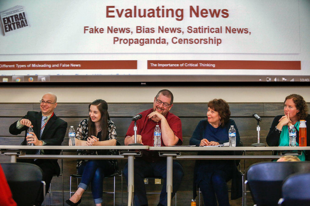 A panel holding a discussion about fake news reacts to the audience Tuesday in the Henry M. Jackson Center’s Wilderness Room. (Dan Bates / The Herald)
