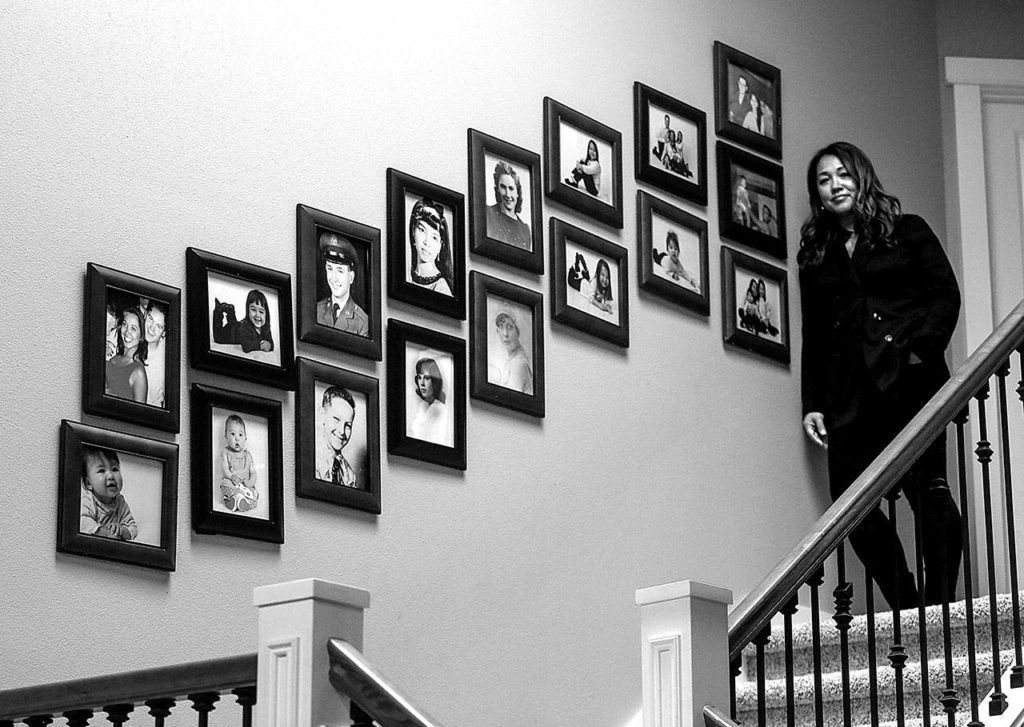Mayume Carelli’s home is filled with faces of people she loves. Her dad, Dan Varnell, was murdered by Gail Brashear in 1996. (Dan Bates / The Herald)
