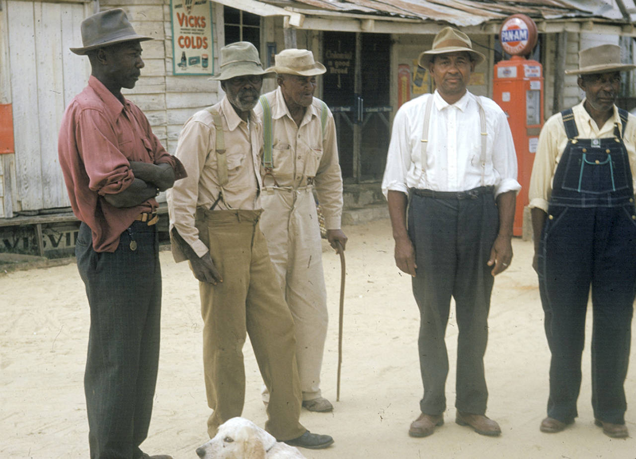In this 1950s photo, men included in a syphilis study pose for a photo in Tuskegee, Alabama. (National Archives via AP)