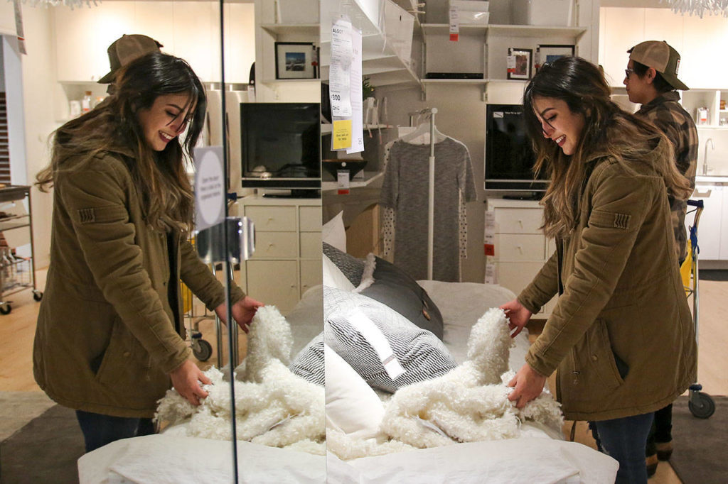 Melissa Vazquez looks the wares on display at the new Ikea store in Renton. (Kevin Clark / The Herald)
