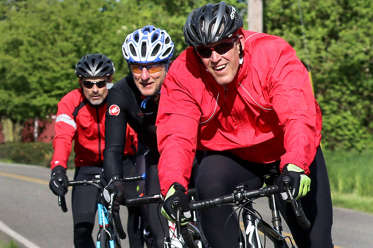 Bike helmets are not required in most Snohomish County cities, but are generally considered a safety must. Here, cyclists make their way along the Arlington Stanwood Loop during the McClinchy Mile Bicycle Ride on April 30. (Herald file photo by Kevin Clark)