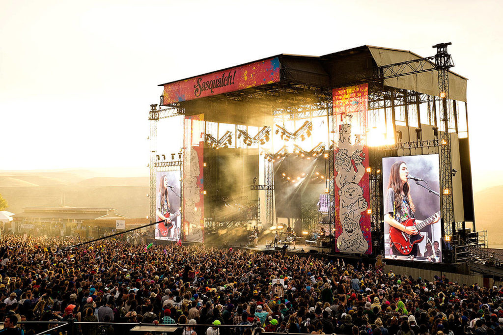 Haim (rhymes with “lime”) rocks the main stage at Sasquatch! Music Festival 2014. The pop-rock band from Los Angeles consists of three sisters: Este Haim (bass), Danielle Haim (guitars and lead vocals) and Alana Haim (guitars and keyboards). (Quinn Russell Brown photo)
