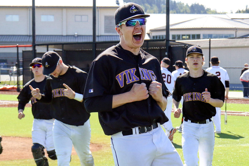 Lake Stevens’ Scott Hicks (front) celebrates with teammates after a win over Monroe in a playoff game on May 6, 2017, in Monroe. Lake Stevens won 2-0. (Kevin Clark / The Herald)
