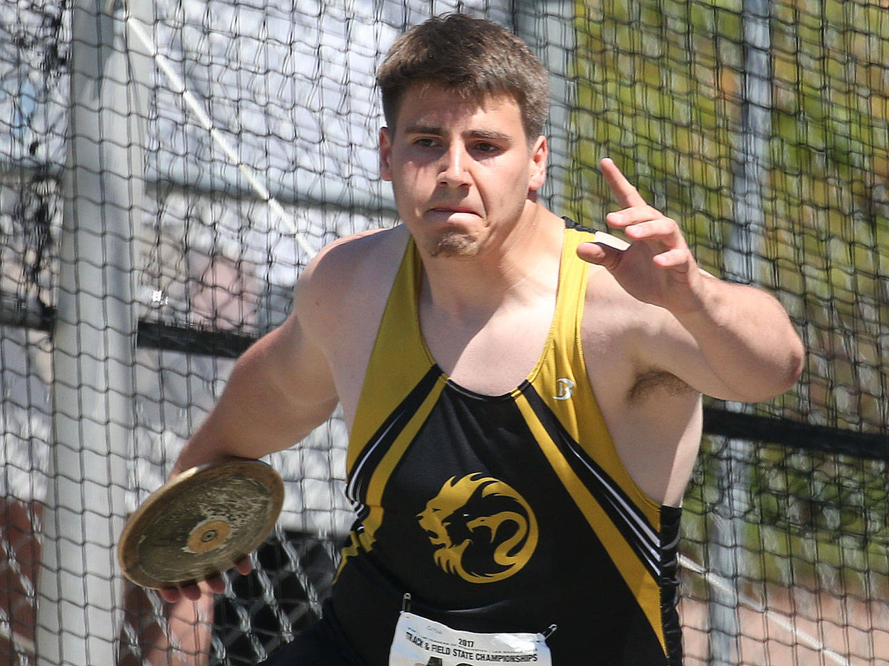 Lynnwood’s Harris Cutuk winds up to throw the discus during the 3A state track and field championships on May 27, 2017, at Mount Tahoma High School in Tacoma. Cutuk won the event with a throw of 171 feet, 5 inches . (Kevin Clark / The Herald)