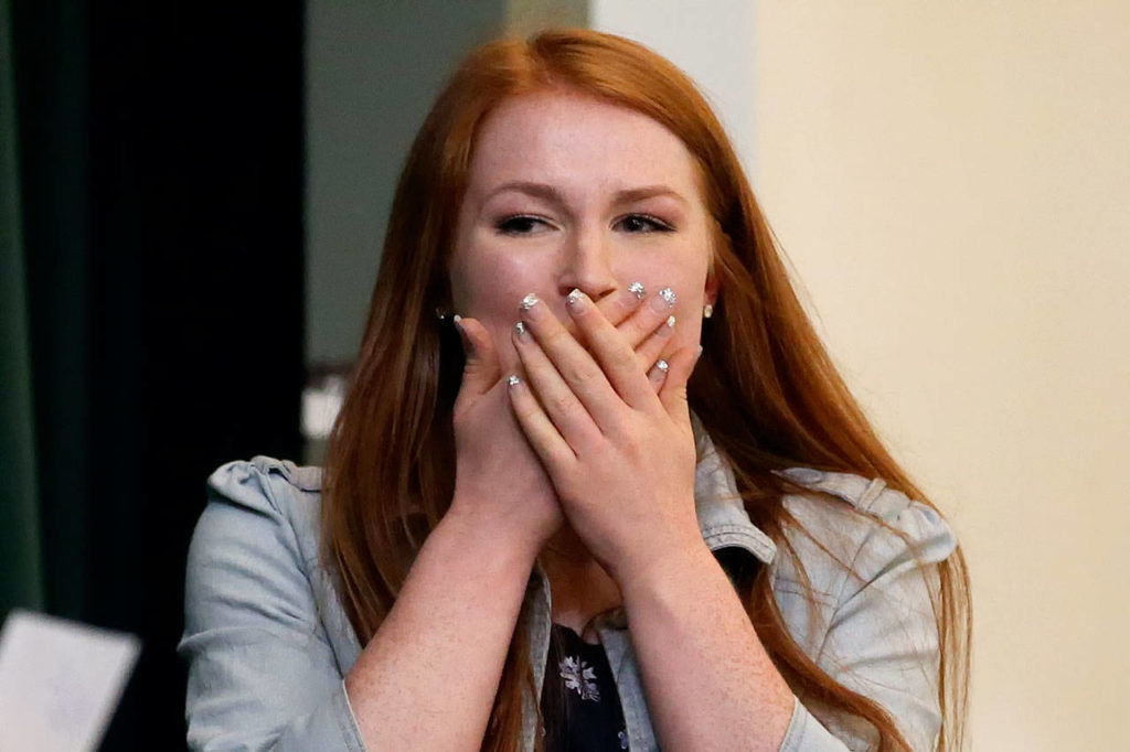 Juliana Cameron reacts to her scholarship Wednesday at Marysville Arts & Technology High School. (Kevin Clark / The Herald)

