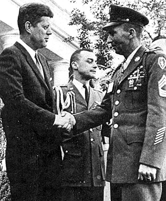 President John F. Kennedy congratulates Wilburn K. Ross. (Wikipedia)