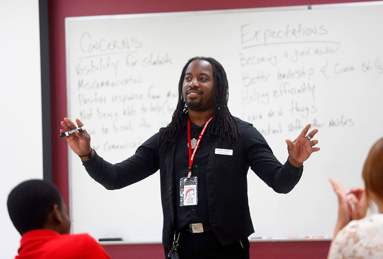 Azrael Howell, then president of the Everett Community College student body, leads a training session for a group of potential student mentors in July, 2015 at the college’s north Everett campus. (Mark Mulligan/Herald file photo)