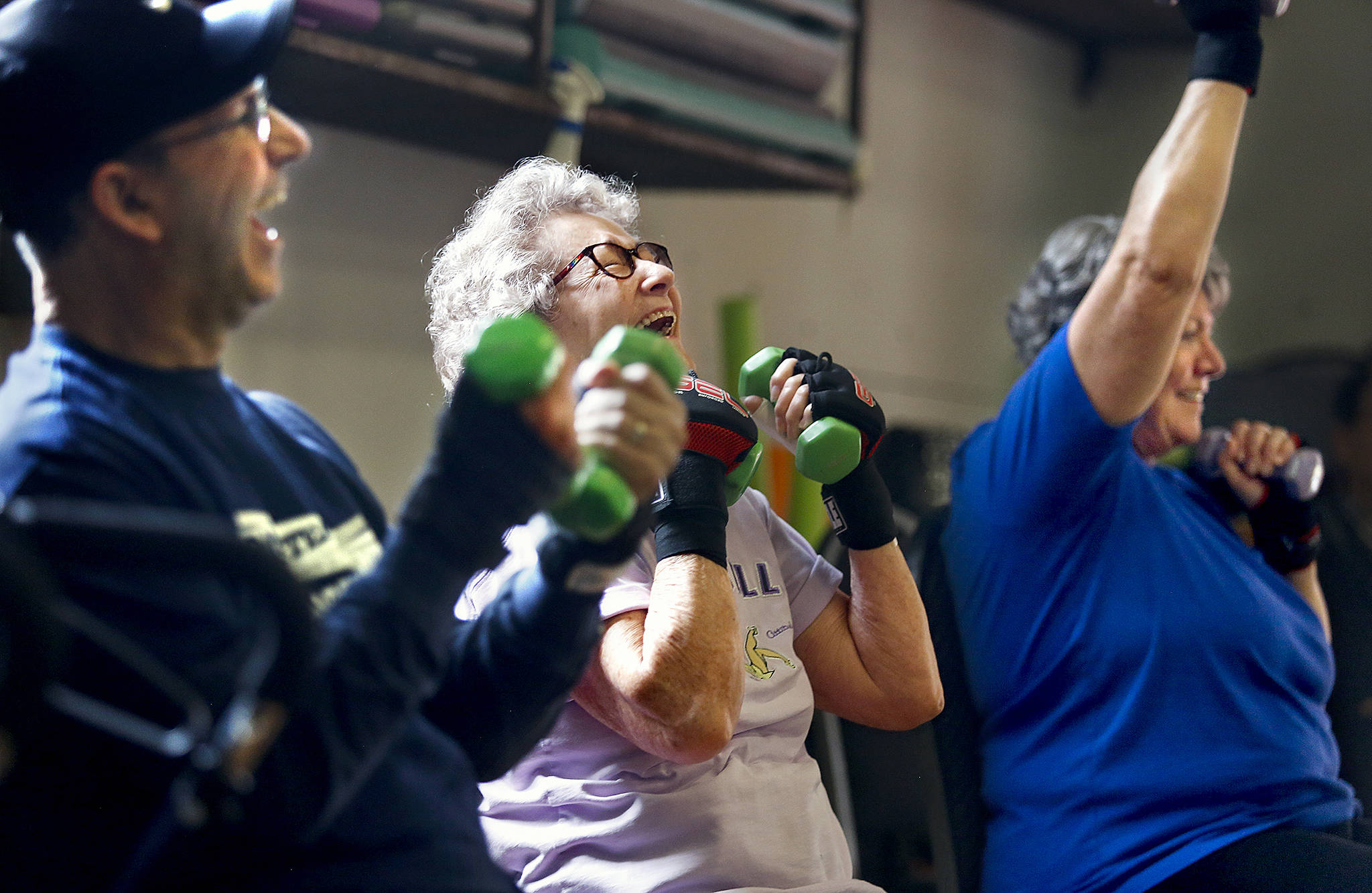 At Snohomish Fitness Center, Richard Striker of Edmonds (left), Donna Thorp of Lynnwood (center) and Rebecca Long of Snohomish enjoy some lighter conversation with a slightly heavier boxing workout. (Dan Bates / The Herald)