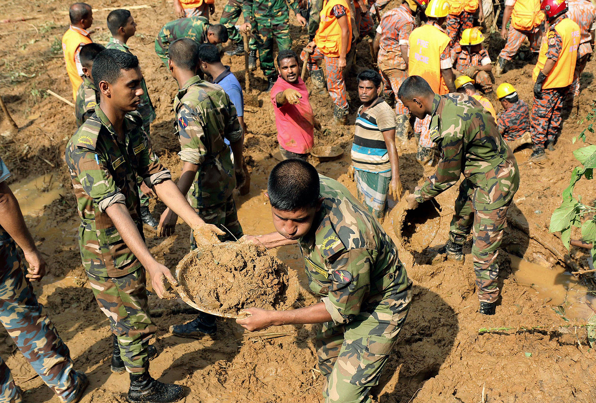 Rescuers search for survivors and bodies after Tuesday’s massive landslide in Rangamati district, Bangladesh, on Wednesday. (AP Photo)