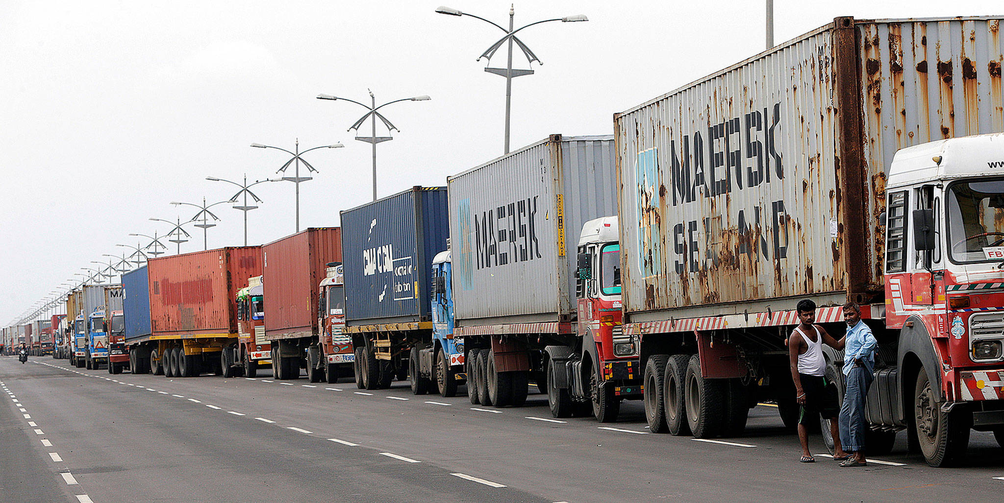 Trucks loaded with containers are lined up outside a terminal at the Jawaharlal Nehru Port Trust in Mumbai, India, on Thursday. Operations at a terminal at India’s busiest container port were stalled by the malicious software that suddenly burst across the world’s computer screens Tuesday. (AP Photo/Rajanish Kakade)