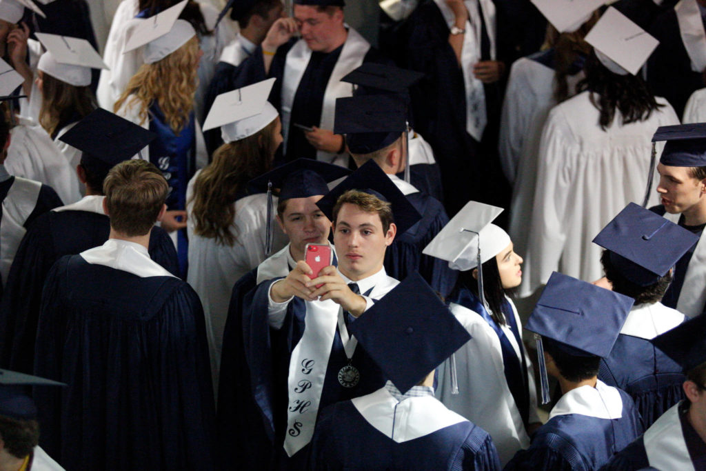 Glacier Peak High School seniors pose for a photo before their graduation ceremony at Xfinity Arena on Monday in Everett. (Andy Bronson / The Herald)
