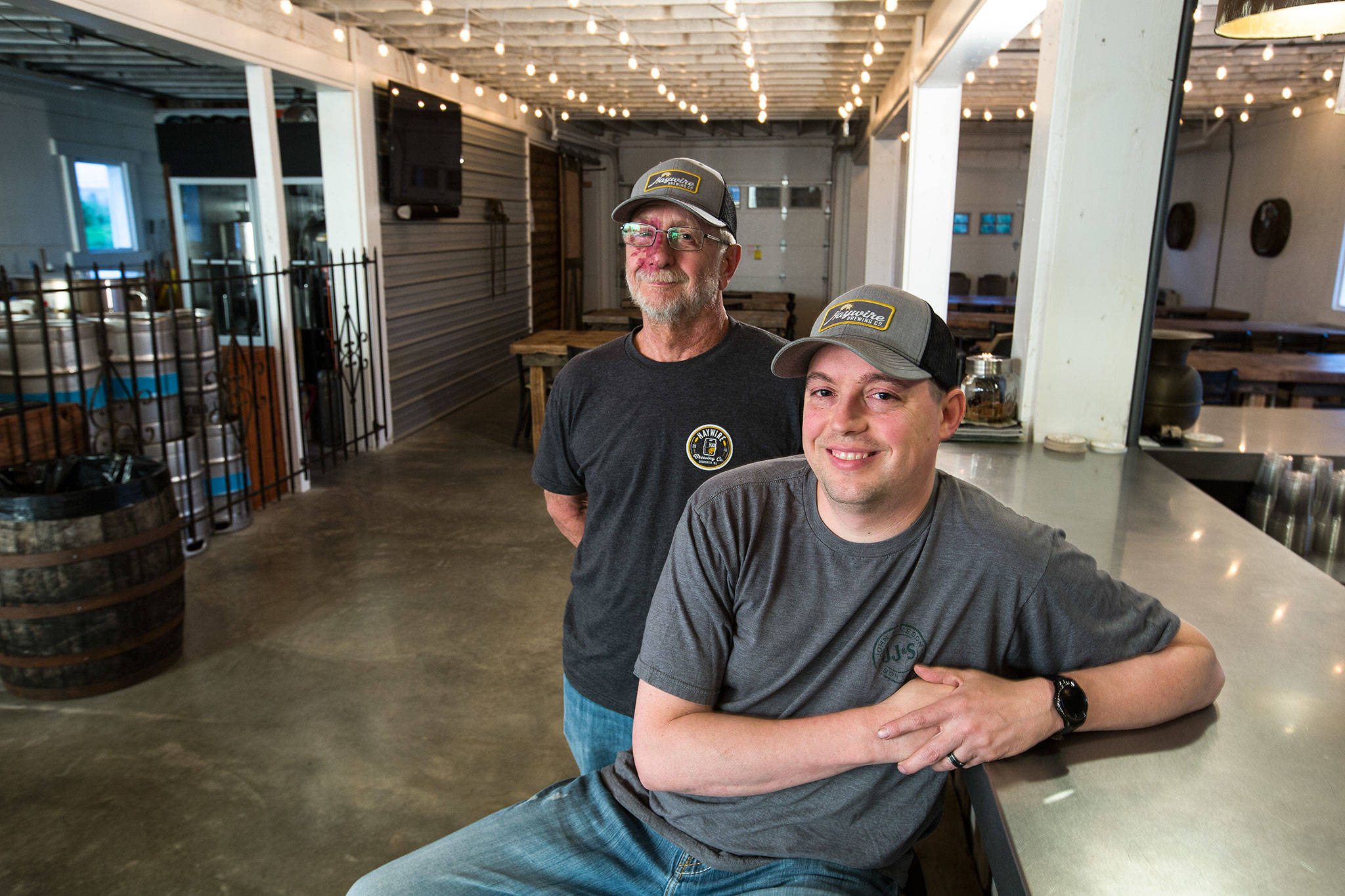 Owner/brewers David Jez and Bryant Castle sit in the main room of Haywire Brewing Co. on May 23 in Snohomish. (Andy Bronson / The Herald)