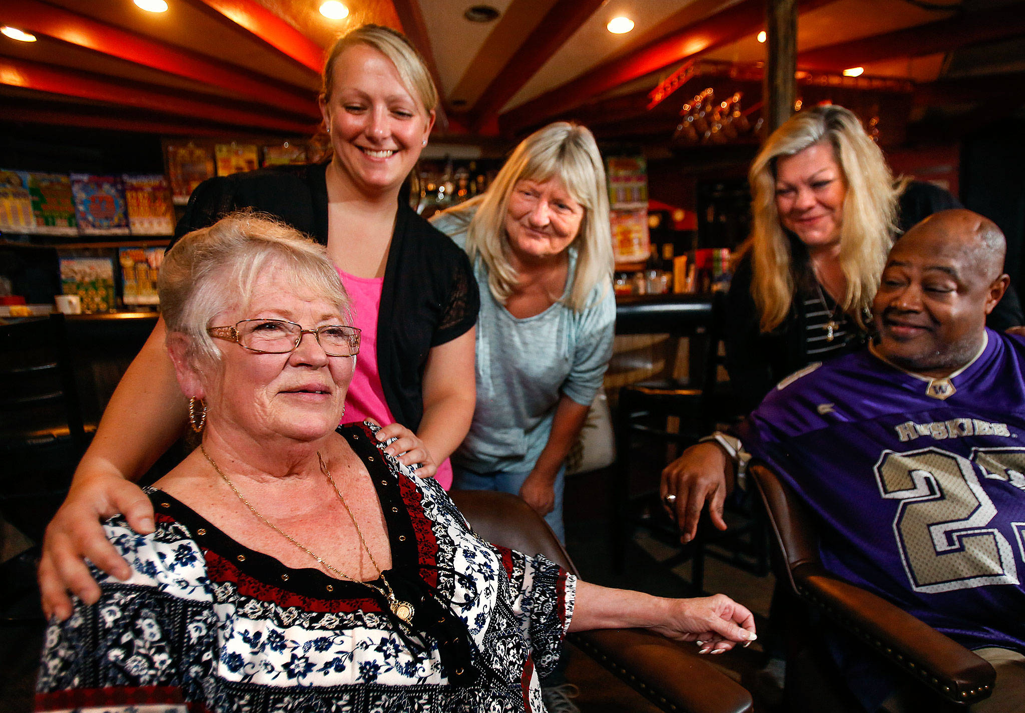 Sue Brauch, (left) a bartender for more than 50 years, is joined and celebrated by friends and colleagues Monday at Patty’s Eggnest, the longtime Chuckwagon Inn, on Evergreen. Behind Brauch at left is new bartender Tricia Flood, her mother and customer Linda Flood, restaurant manager Pam Gahan, and loyal customer Dwight Jeffries. Brauch, 76, is retiring this week after 13 years behind the bar at the Everett lounge and restaurant. (Dan Bates / The Herald)