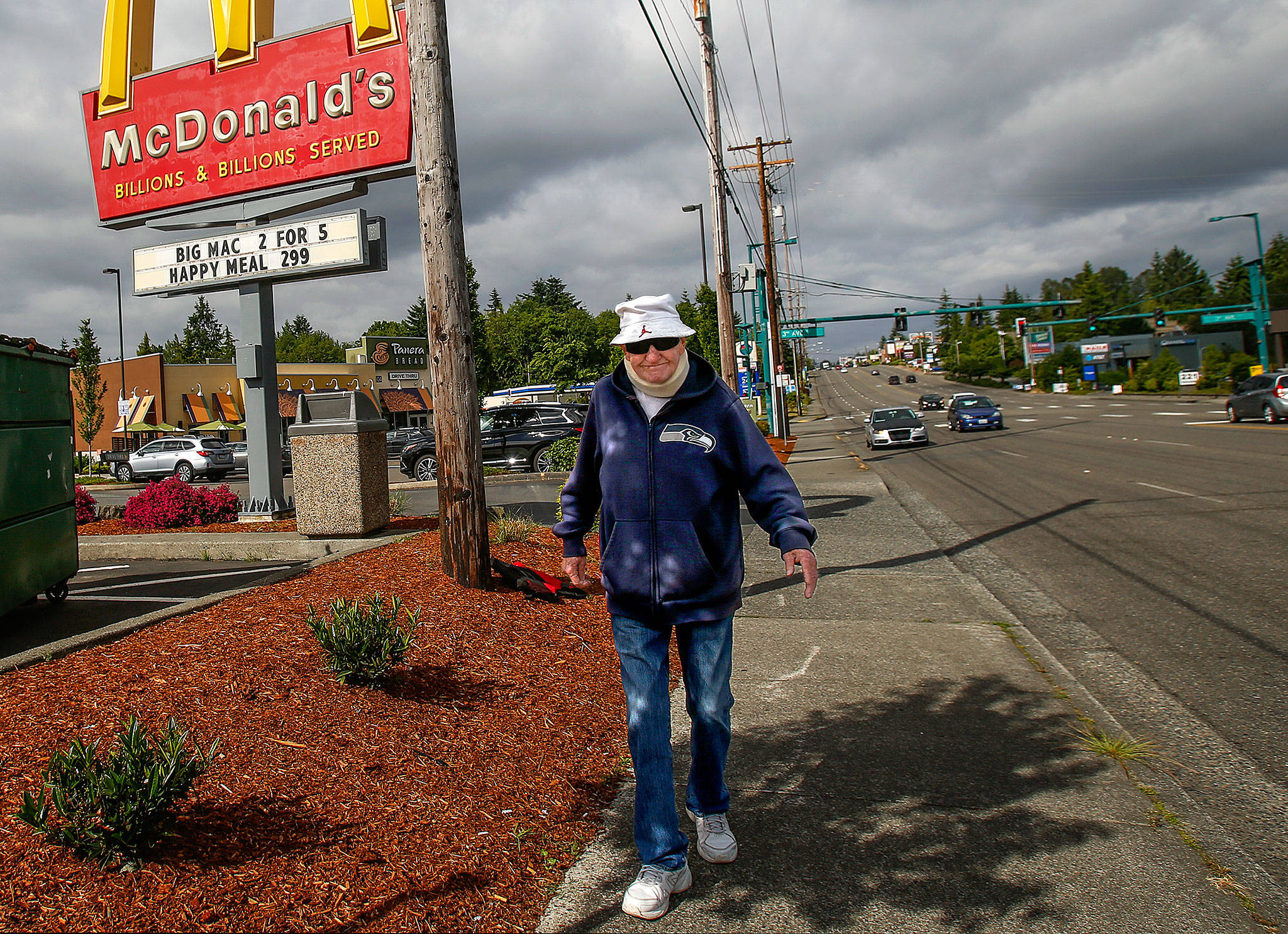 Step by step, Ron Williams, 84, makes his way along Everett Mall Way. He walks six miles each day, sometimes stopping at McDonald’s between his morning and afternoon three-mile walks. (Dan Bates / The Herald)