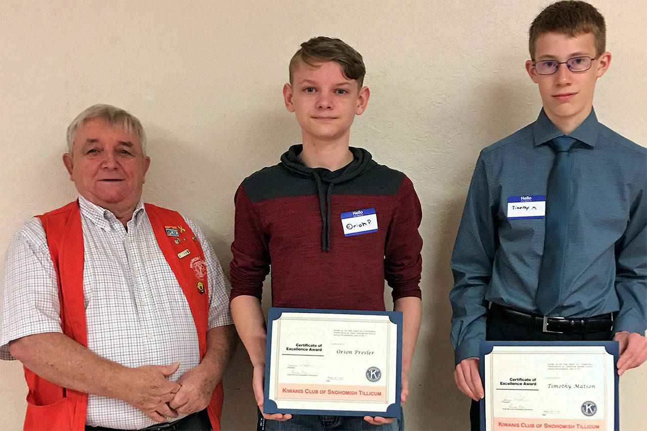Snohomish Tillicum Kiwanis treasurer John Bruce congratulates Orion Presler and Timothy Matson as Dux Award winners. (Contributed photo)