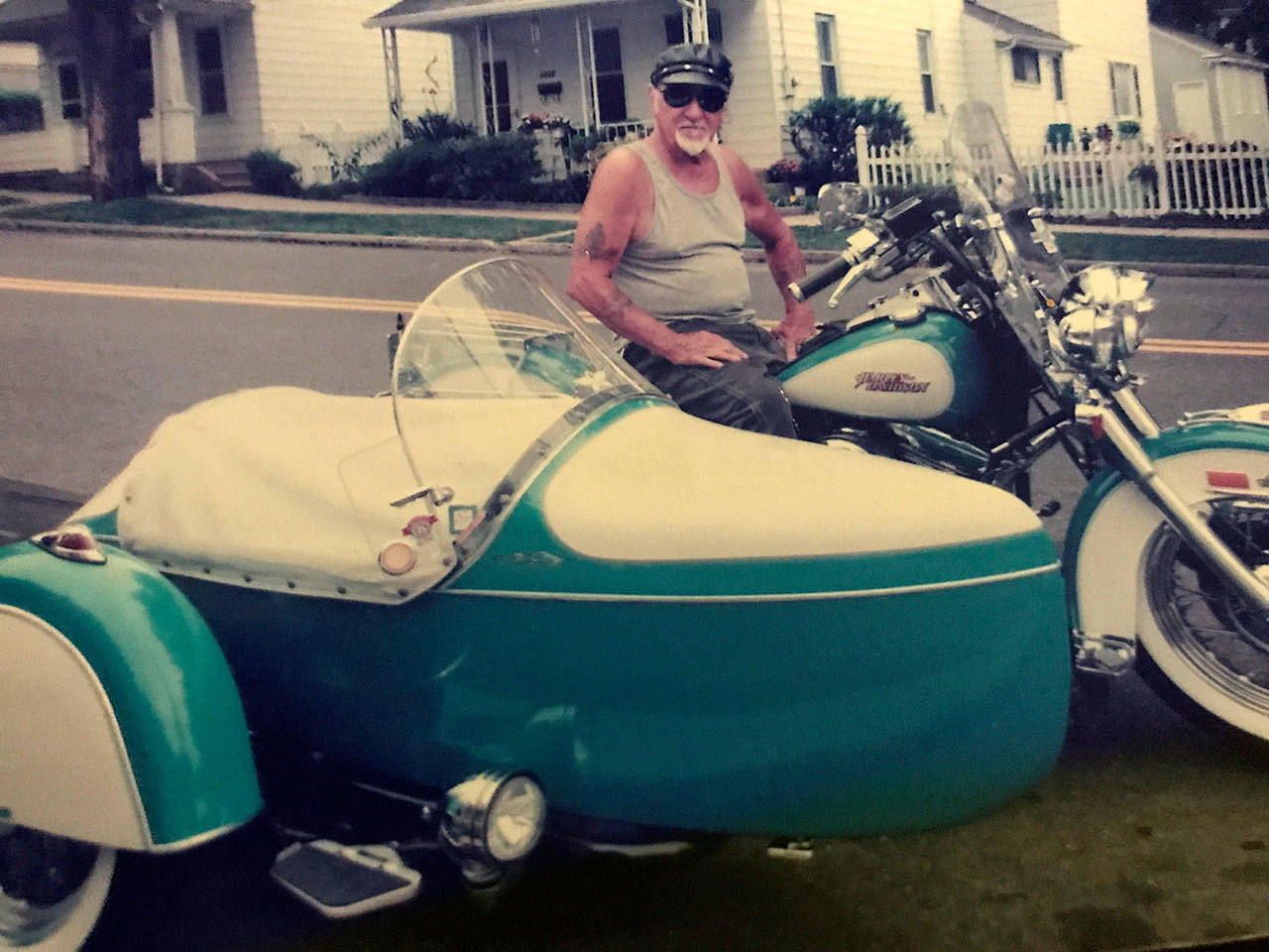 In this 2010 photo provided by the family of Arthur Werner Sr., Werner poses for a photo on his 1990 Harley-Davidson Heritage Softail motorcycle in Bethlehem, Pennsylvania. Werner, of Steel City, died of cancer Sunday, but made plans to be buried in his motorcycle’s sidecar after his funeral, which is scheduled for Friday. (Brittany Werner via AP)