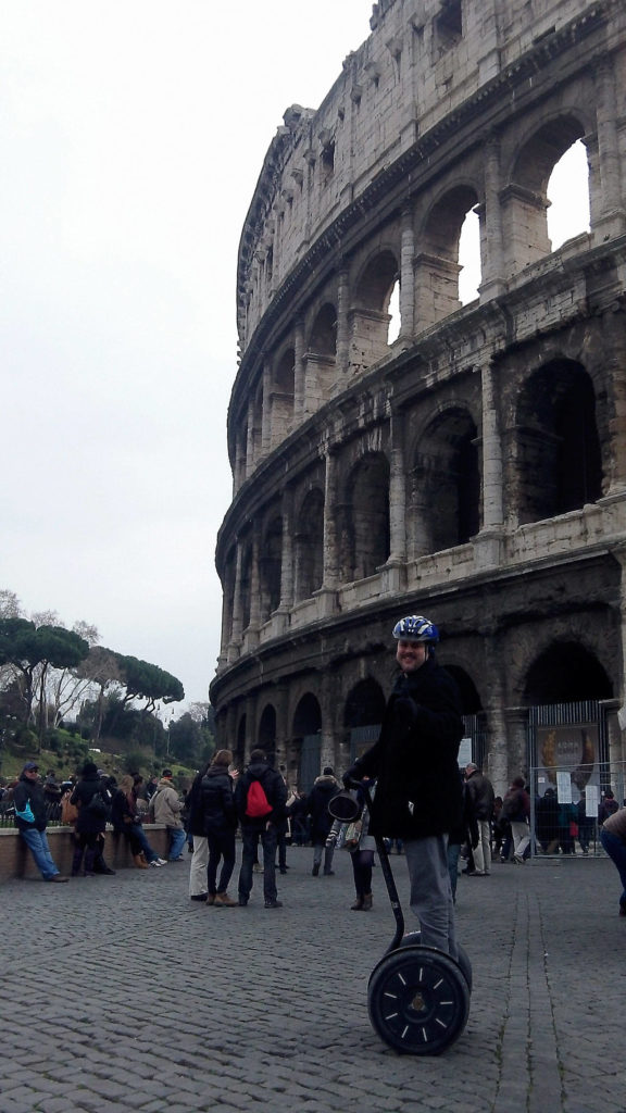 Italy4Real and Travel4Real owner Rem Malloy uses a Segway to explore outside the Colosseum in Rome. (Contributed photo)
