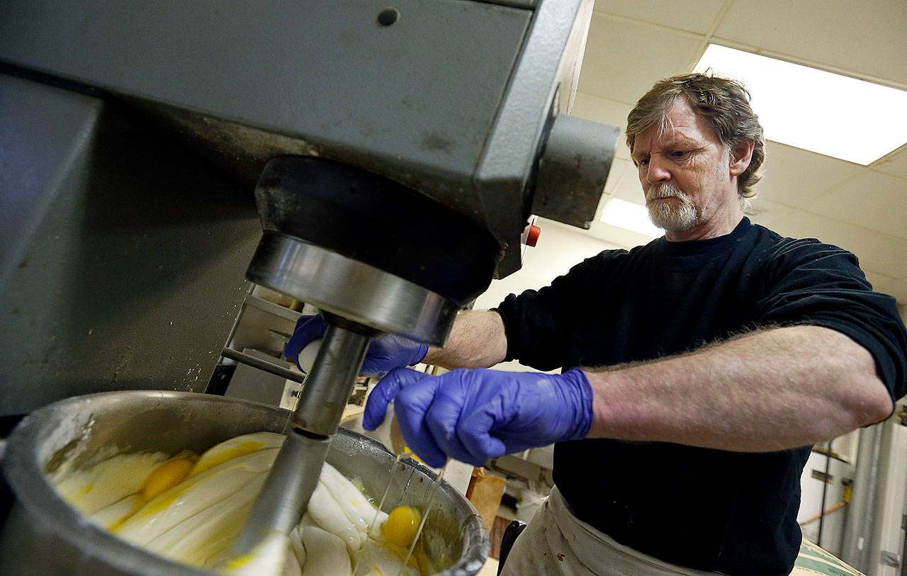 Masterpiece Cakeshop owner Jack Phillips cracks eggs into a cake batter mixer at his store in Lakewood, Colorado. The Supreme Court said it will consider whether a baker who objects to same-sex marriage on religious grounds can refuse to make a wedding cake for a gay couple. (AP Photo/Brennan Linsley, File)