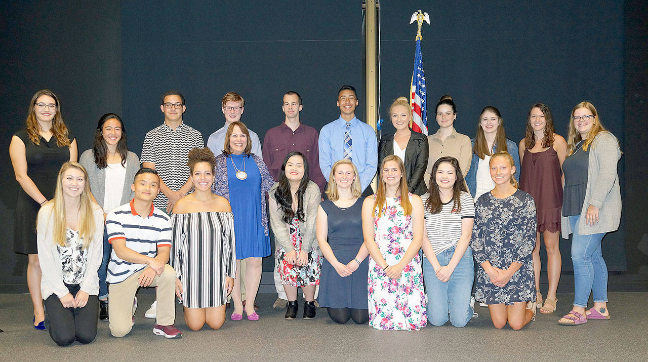 Rotary Club of Lynnwood President Marilla Sargent stands with scholarship winners at a June 1 ceremony. The Rotary Club of Lynnwood granted $75,000 in scholarships to 22 students. (Contributed photo)