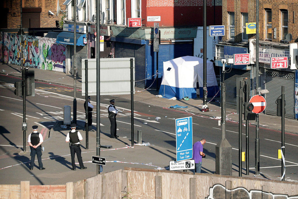 A police forensic tent at Finsbury Park in north London, where a vehicle struck pedestrians on Monday near a mosque. (Yui Mok/PA via AP) 
