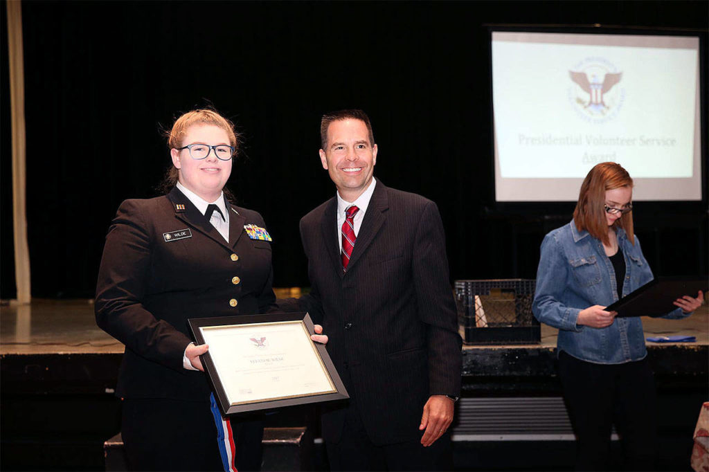 Navy Junior ROTC Cadet Eleanor Wilde earns a Presidential Volunteer medal for 294 hours of community service in one year, presented by Marysville Mayor Jon Nehring. (Contributed photo)
