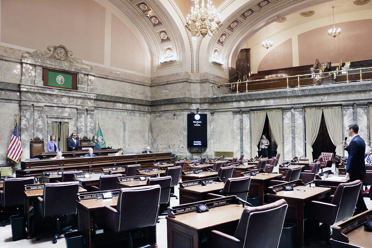 This May 23 photo shows Republican Sen. Joe Fain (far right) speaking in a mostly empty Senate chamber during adjournment of a 30-day special legislative session in Olympia. (AP Photo/Rachel La Corte)