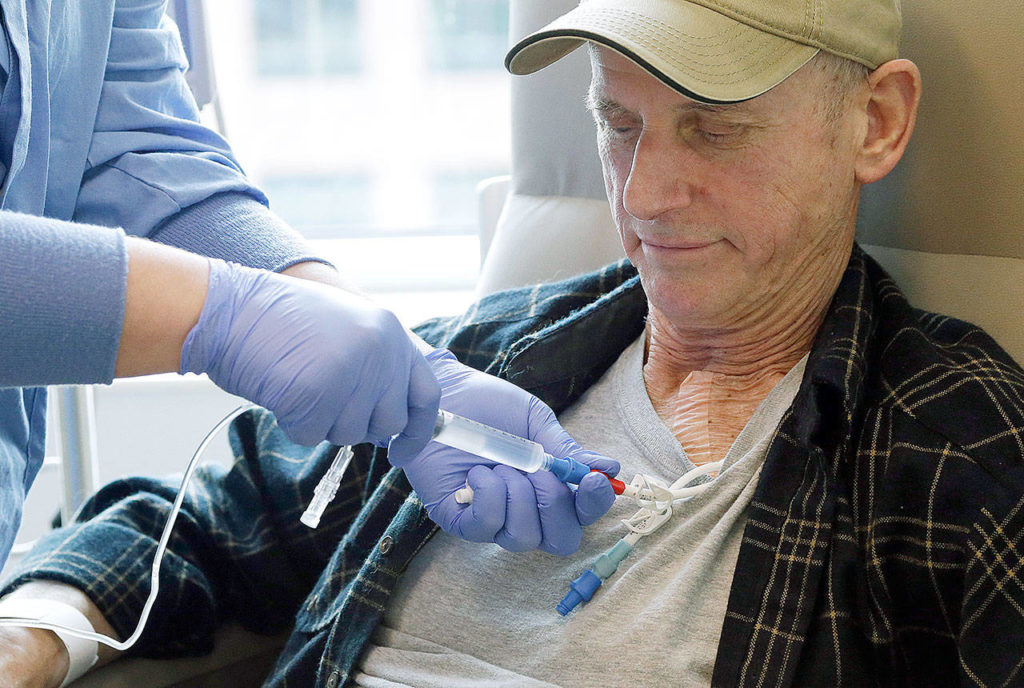 Lymphoma patient Peter Bjazevich receives cellular immunotherapy as part of a study at the Fred Hutchinson Cancer Research Center in Seattle. (AP Photo/Elaine Thompson) 
