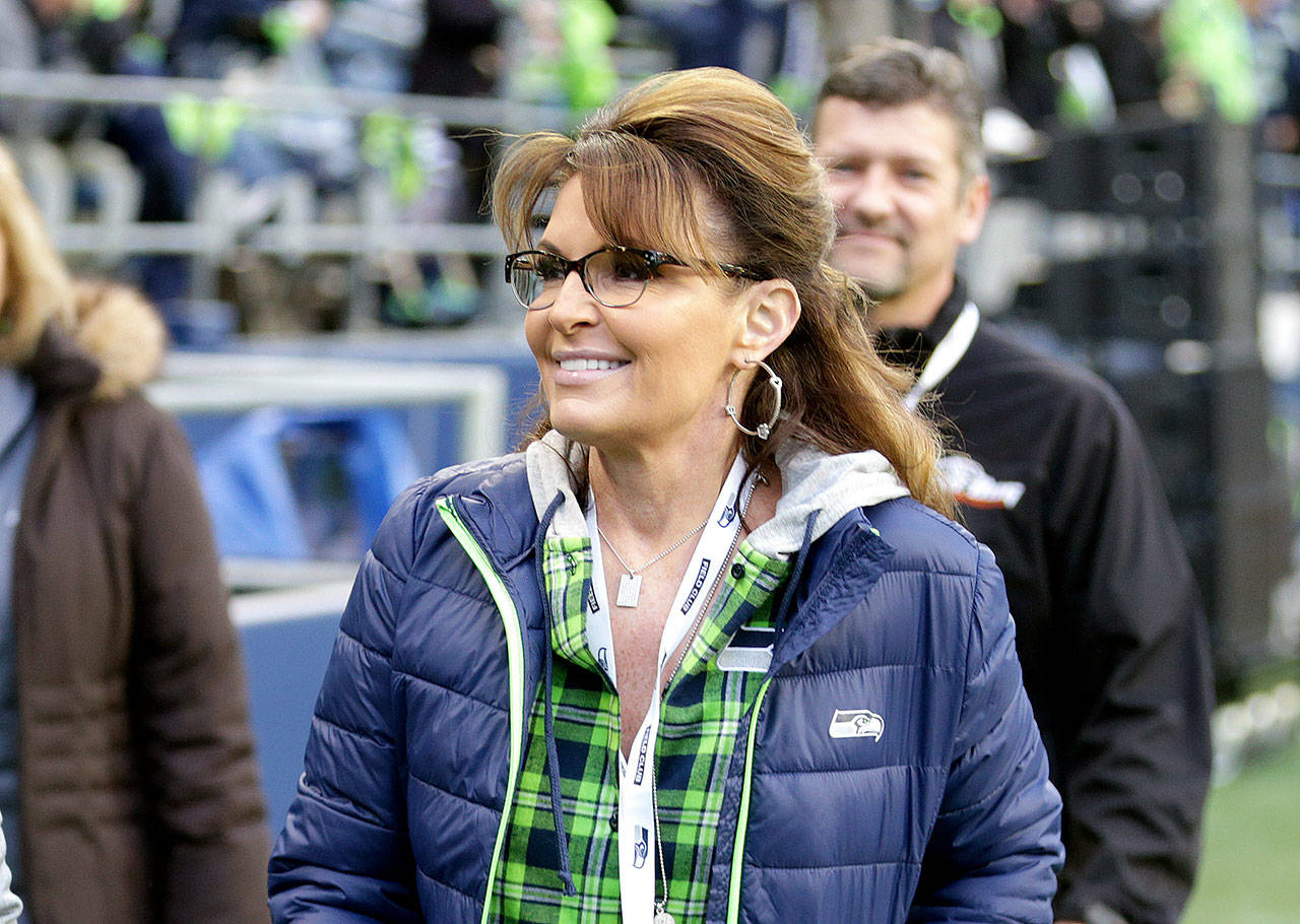Sarah Palin, political commentator and former governor of Alaska, walks on the sideline before an NFL football game between the Seattle Seahawks and the Los Angeles Rams in Seattle in December. (AP Photo/Scott Eklund, File)