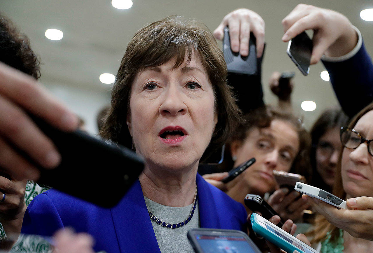 Sen. Susan Collins, R-Maine, speaks amid a crush of reporters at the Capitol in Washington on Thursday after Republicans released their long-awaited bill to scuttle much of President Barack Obama’s Affordable Care Act. (AP Photo/J. Scott Applewhite)