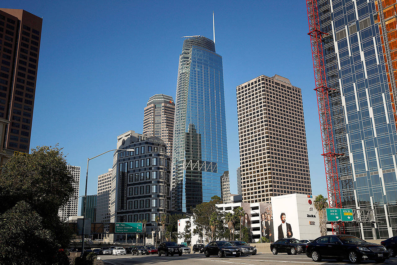 Traffic moves past the 73-story, 1,100-foot-high Wilshire Grand Center on Thursday in Los Angeles. (AP Photo/Jae Hong)