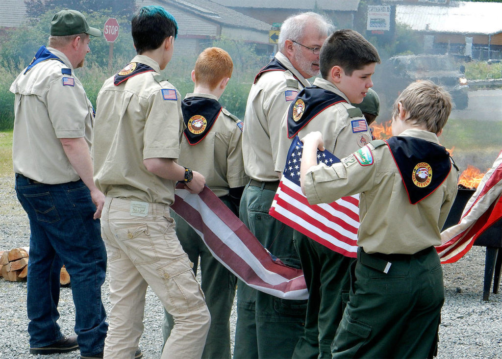 American Legion Post 181 in cooperation with Boy Scouts of America’s Mount Baker Council Troop 42 gathered June 10 to properly retire more than 315 U.S. flags. (Contributed photo)
