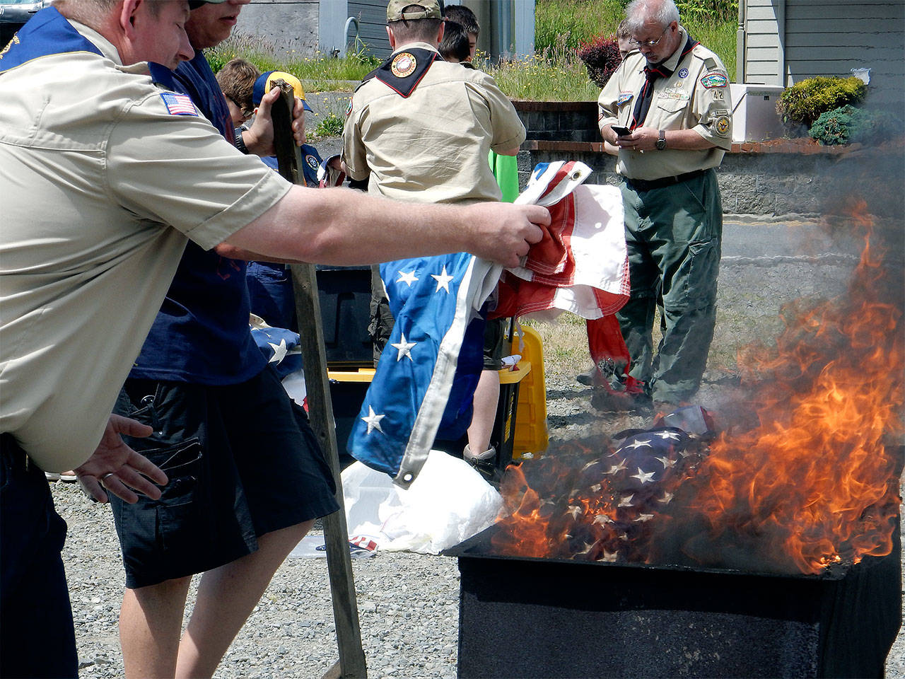 American Legion Post 181 in cooperation with Boy Scouts of America’s Mount Baker Council Troop 42 gathered June 10 to properly retire more than 315 U.S. flags. (Contributed photo)