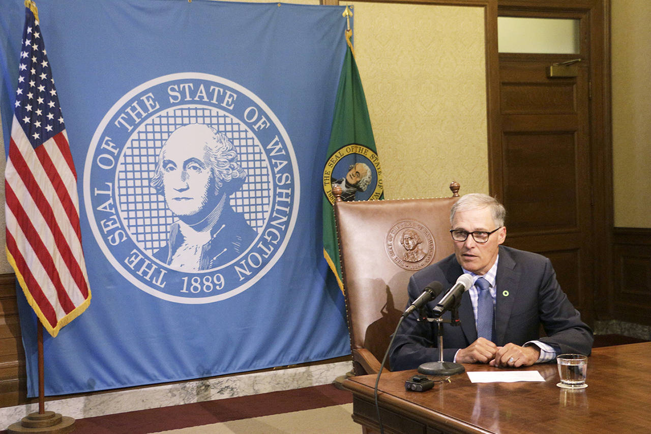 Gov. Jay Inslee talks to reporters about ongoing budget negotiations Tuesday in Olympia. (Rachel La Corte / Associated Press)