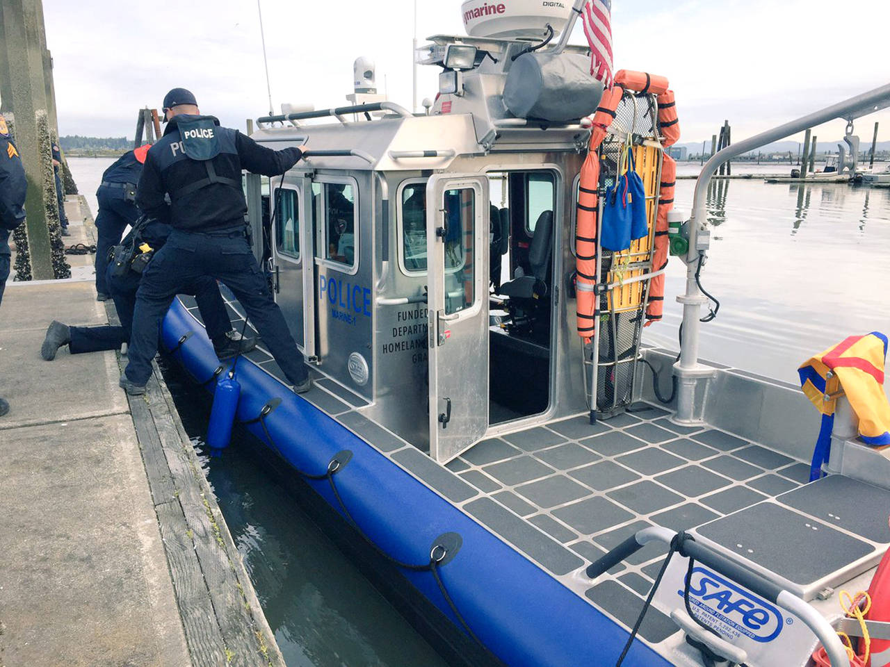 Everett police and firefighters helped rescue a man Thursday night after he fell overboard from a fishing boat near Jetty Island. (Everett Police)