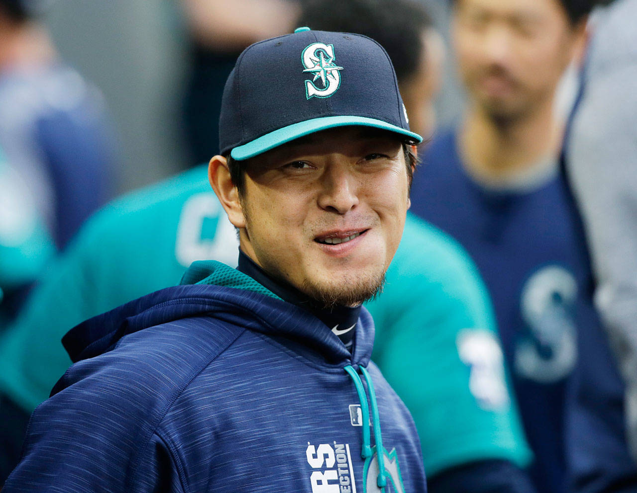 Mariners pitcher Hisashi Iwakuma smiles as he stands in the dugout before a game against the White Sox on May 19, 2017, in Seattle. (AP Photo/Ted S. Warren)