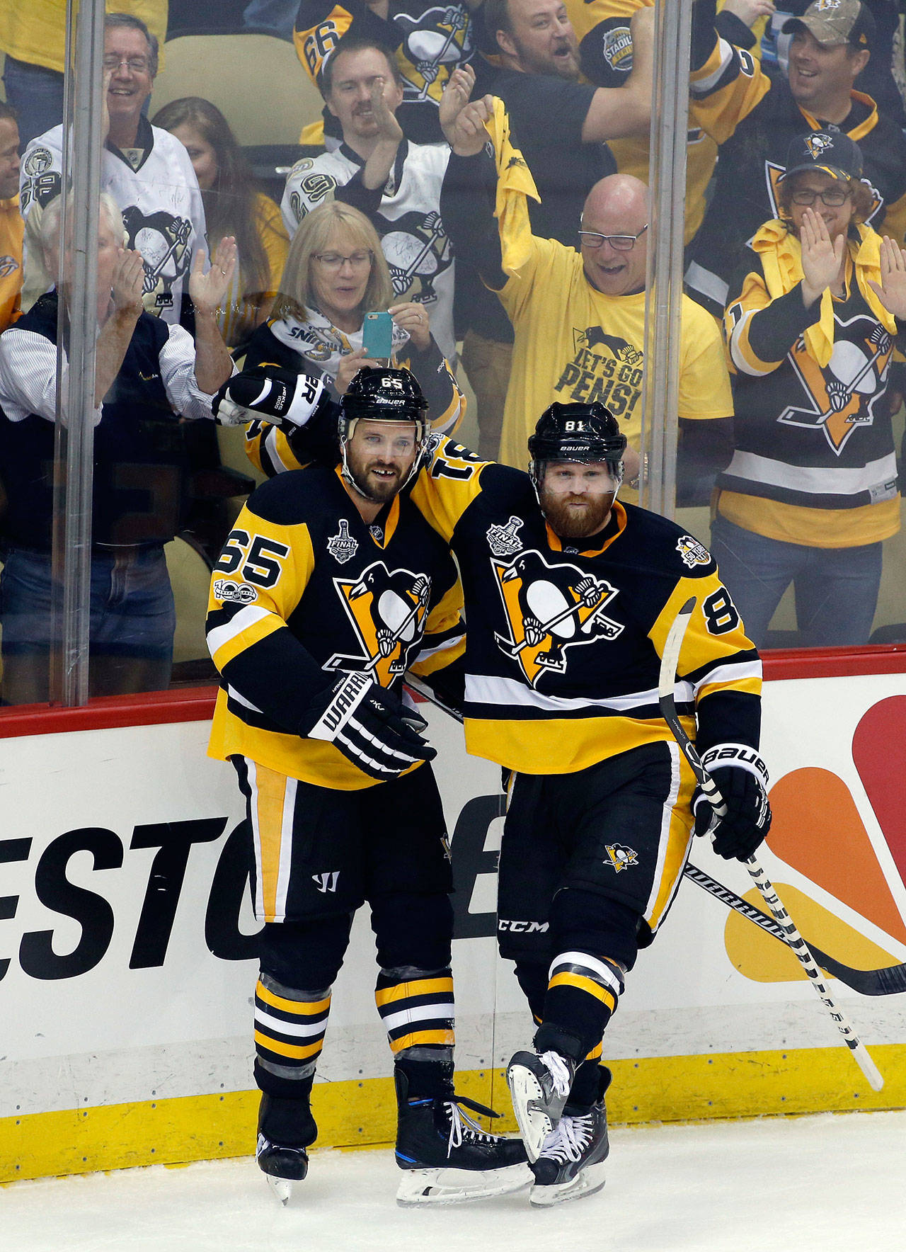 The Penguins’ Ron Hainsey (left) celebrates his goal against the Predators with Phil Kessel during the second period of Game 5 of the Stanley Cup Final on June 8, 2017, in Pittsburgh. (AP Photo/Gene J. Puskar)