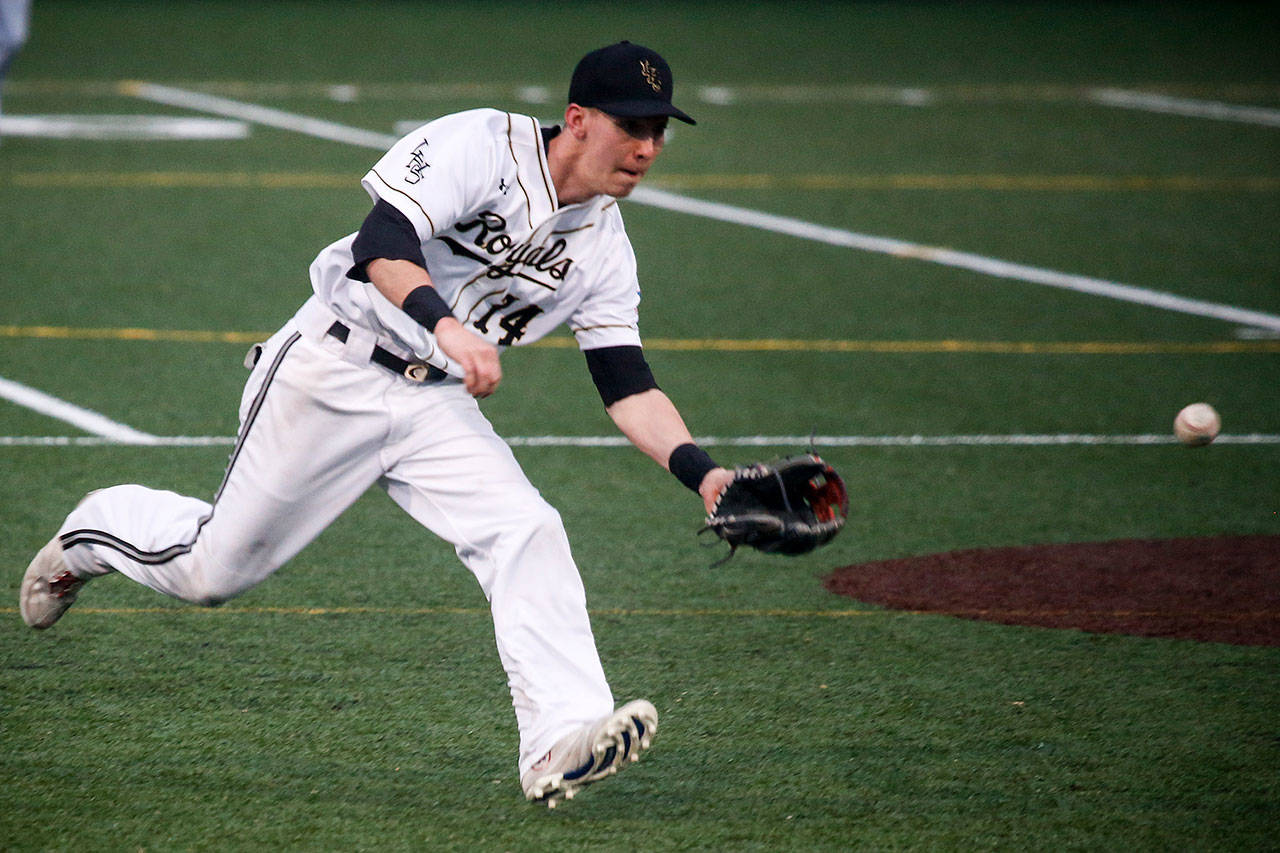 Lynnwood shortstop Kyler McMahan fields a ground ball on the run during a game against Snohomish on March 28, 2017, at Mountlake Terrace High School. (Ian Terry / The Herald)