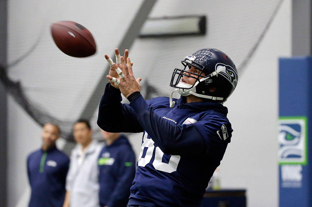 Seahawks tight end Jimmy Graham reaches to catch the ball during practice on June 15, 2017, in Renton. (AP Photo/Elaine Thompson)