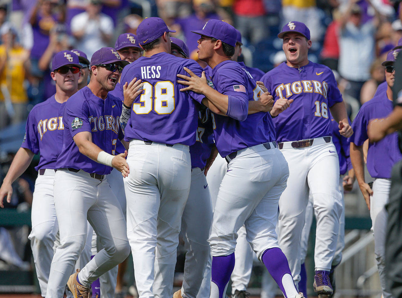 LSU players celebrate with closing pitcher Zack Hess (38) after the last out against Oregon State in an NCAA College World Series elimination game on June 24, 2017, in Omaha, Neb. (AP Photo/Nati Harnik)