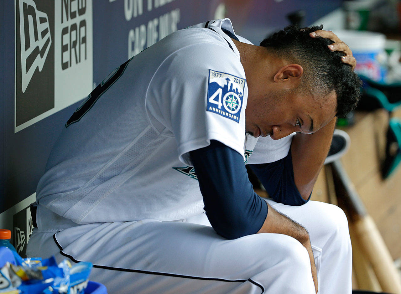 Mariners pitcher Edwin Diaz sits in the dugout after he was pulled from a game against the Phillies in the ninth inning on June 28, 2017, in Seattle. (AP Photo/Ted S. Warren)