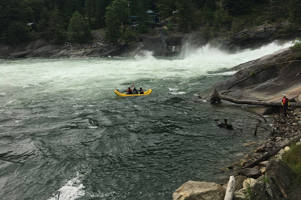 Members of the Snohomish County Sheriff’s Office dive team and search and rescue volunteers search the pool of water at the base of Sunset Falls, on the Skykomish River near Index, for a man who reportedly fell in Saturday afternoon. The man was not located. (Snohomish County Sheriff’s Office)